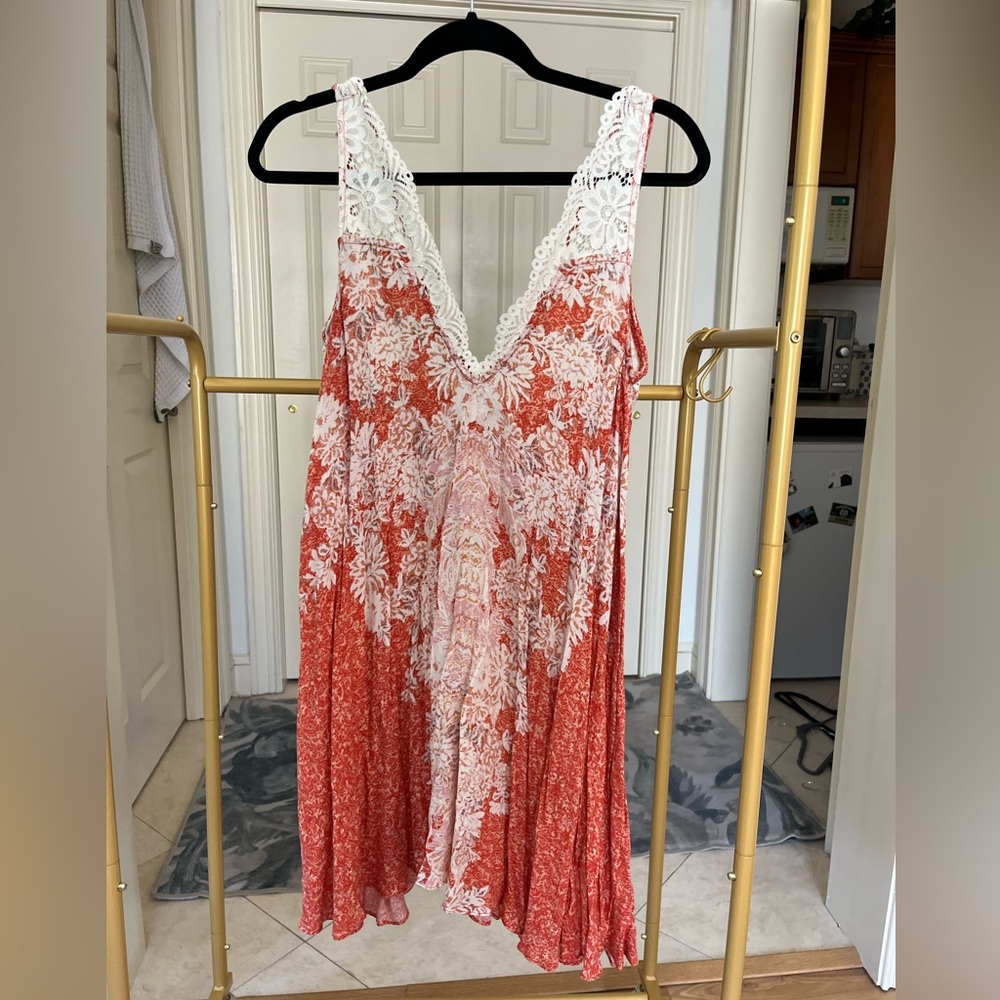Like new- Free People sundress. Lace detailing with tie back.